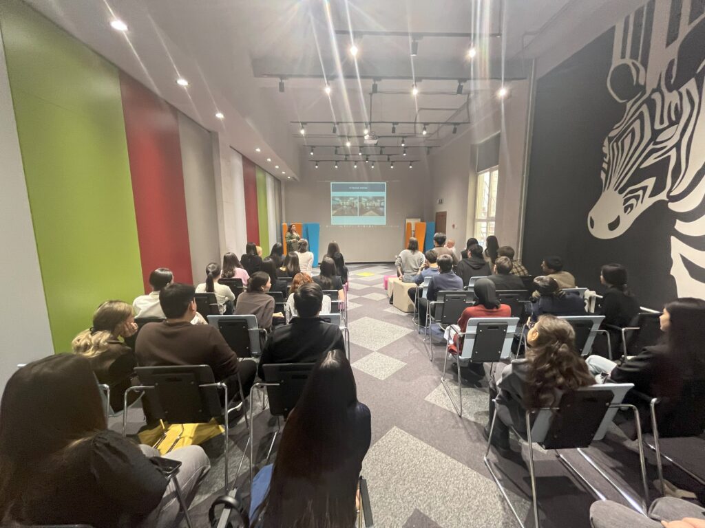 Kazakh students watch a presentation at the Job Fair